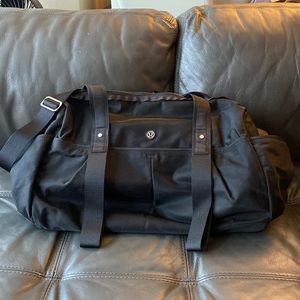 Barely used black Lululemon Duffle w/yoga mat holder